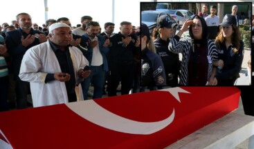 Polis eşini son yolculuğuna selam vererek uğurladı